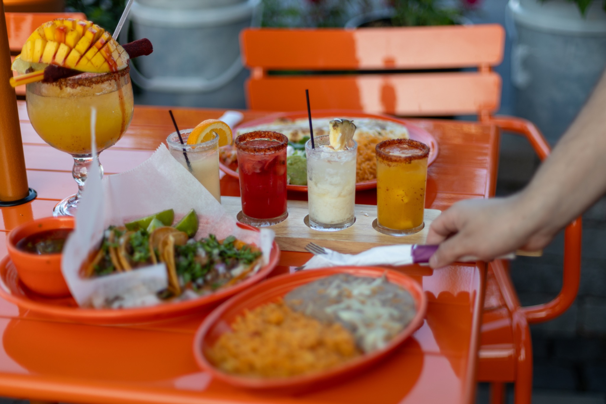 Mexican food and margaritas on an orange patio table at Nuevo Vallarta